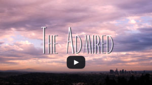 A picture of the sky with clouds and text that reads " the admired ".